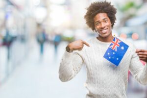 afro american man flag of australia over isolated 2025 10 13 03 37 30 utc
